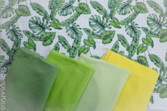 Puuvillane_trikotaaž_Rohelised_lehed_ruudulisel_taustal